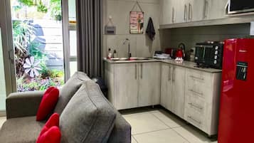 Family Double Room, Patio, Garden View | Private kitchen | Full-size fridge, microwave, oven, stovetop