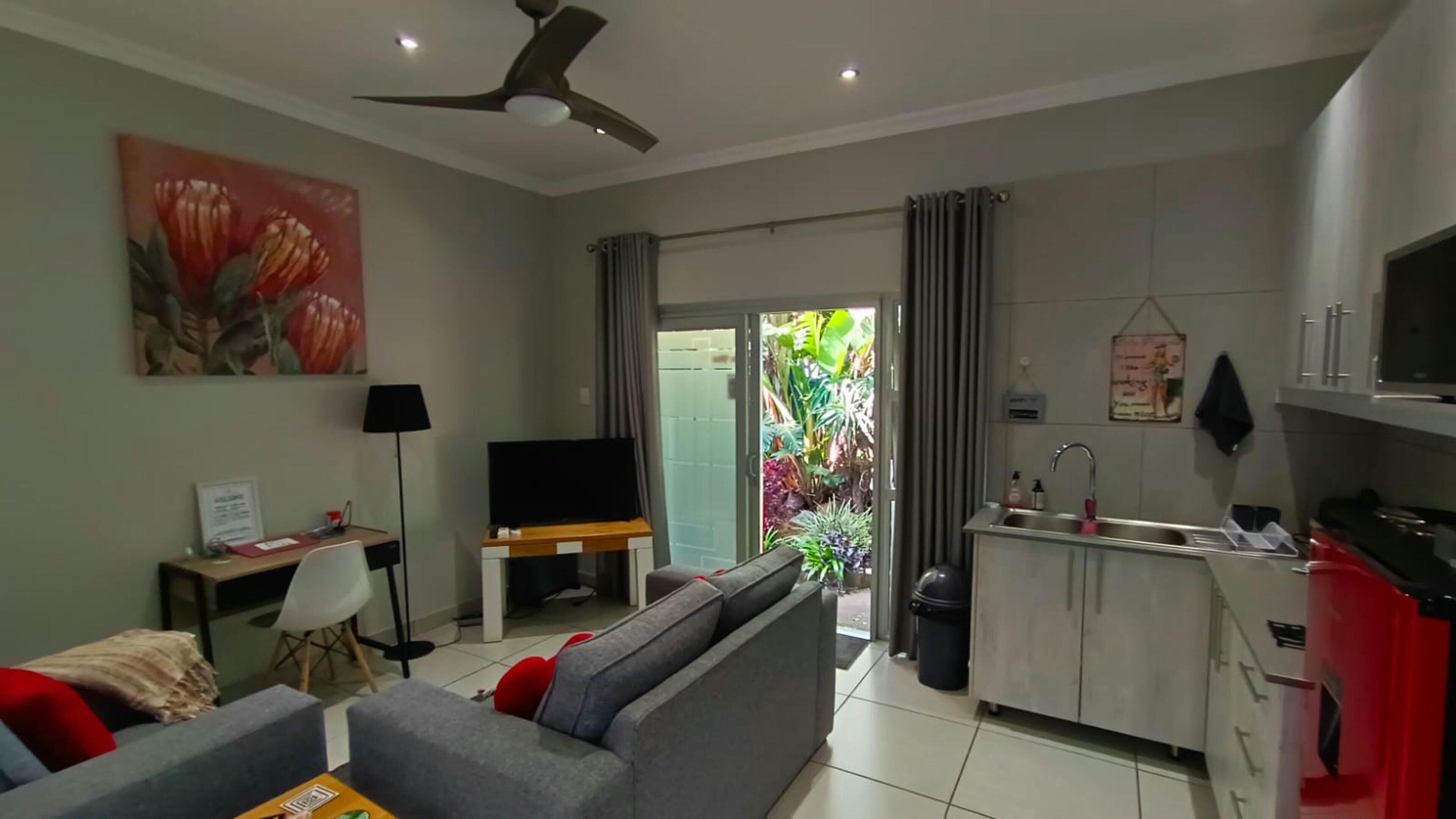 Family Double Room, Patio, Garden View | Living room | 52-inch Smart TV with satellite channels, Netflix, books