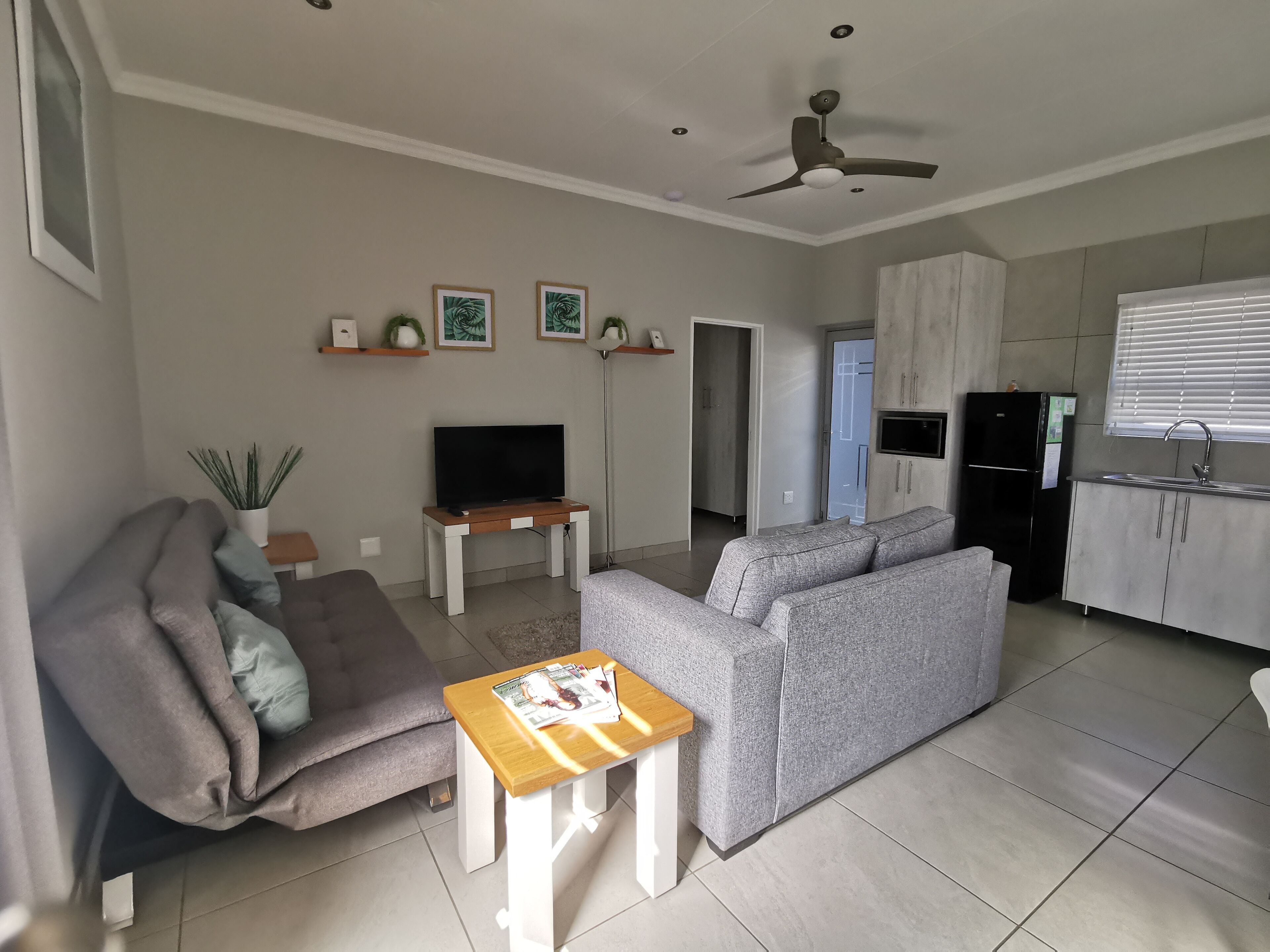 Luxury Double Room, Patio, Garden View | Living area | 52-inch Smart TV with satellite channels, Netflix, books