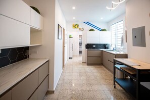 Fridge, microwave, stovetop, coffee/tea maker