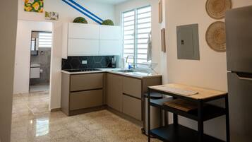 Fridge, microwave, stovetop, coffee/tea maker