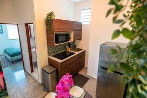 Fridge, microwave, stovetop, coffee/tea maker
