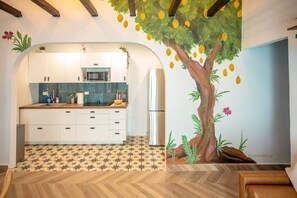 Fridge, microwave, stovetop, coffee/tea maker