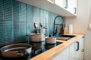 Fridge, microwave, stovetop, coffee/tea maker