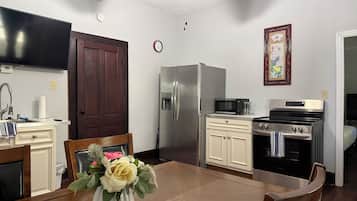 Fridge, coffee/tea maker, toaster, cookware/dishes/utensils