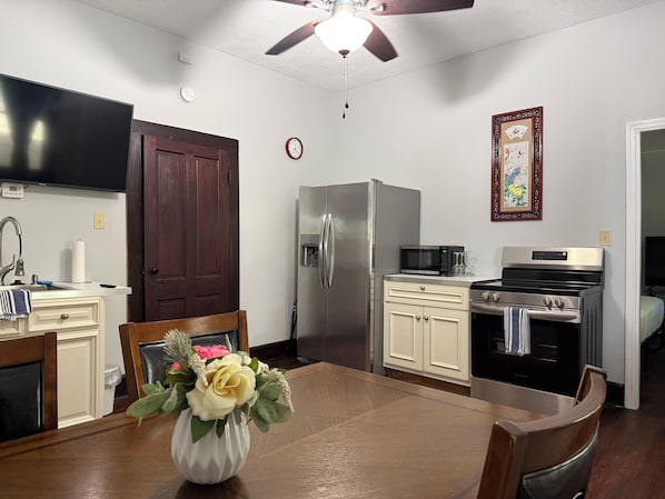 Fridge, coffee/tea maker, toaster, cookware/dishes/utensils