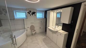 Shower, hair dryer, bidet, towels