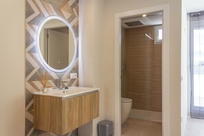 Family Studio Suite, Balcony, Sea View | Bathroom | Shower, hair dryer, towels, soap