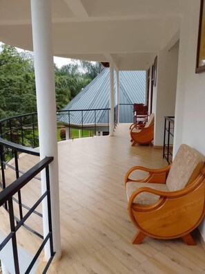 Deluxe Double Room, Garden View | Balcony view