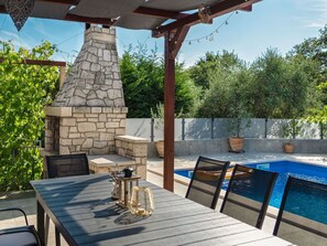 Furniture, Outdoor Furniture, Chair, Table, Shade, Swimming Pool, Outdoor Table, Composite Material, Resort, Patio