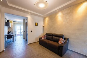 Apartment (1 Bedroom) | Living area | 32-inch Smart TV with cable channels - Amedeo di Savoia Sea & Sunsets (Naples)