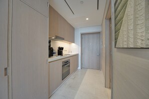 Luxury Studio, Sea View | Private kitchen | Full-size fridge, microwave, oven, stovetop