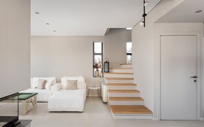 Luxury Villa, Sea View | Living area | 50-inch Smart TV with digital channels, fireplace