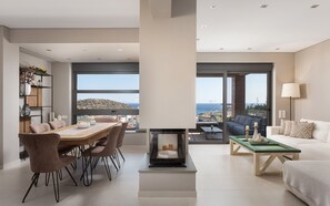 Luxury Villa, Sea View | Living room | 50-inch Smart TV with digital channels, fireplace