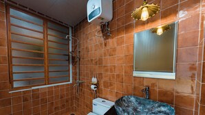 A bathroom with a toilet, sink with a marble basin, shower, and a window with blinds. - Charming Private Room with Balcony – Local Homestay with Host Family, Cozy Stay (Tỉnh Thừa Thiên Huế)