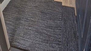 A hallway with wooden flooring, white walls, and a carpeted entrance. - A stylish, family and pet friendly beach retreat near everything! (Cowes)