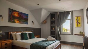 A bedroom with a bed, nightstands, a painting, a window with curtains, and a radiator.
