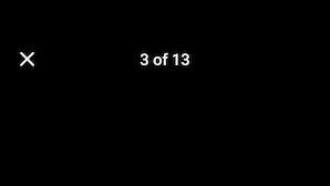 A compact kitchen with a wooden table and two chairs, a microwave, and a refrigerator. - Charming Maltese townhouse (Il-Mosta)