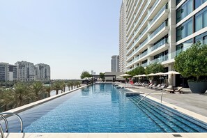 Outdoor pool, pool umbrellas, pool loungers