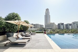 Outdoor pool, pool umbrellas, sun loungers