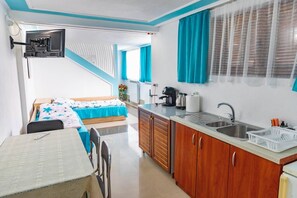 A compact kitchenette with a sink, a coffee maker, and a small countertop. - Cozy Villa Retreat in Cigov Chark (Batak)