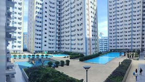Condo, 1 Bedroom, Private Pool, City View | Pool | Outdoor pool - Cozy City View Condo in Quezon City - Your Home Away From Home (Quezon City)