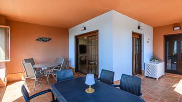 Apartamento | Restaurante al aire libre