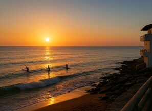 On the beach, sun-loungers