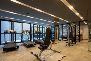 A modern gym with treadmills, weight machines, and free weights. - Modern Apartment in Vila Mariana Hma0305 (São Paulo)