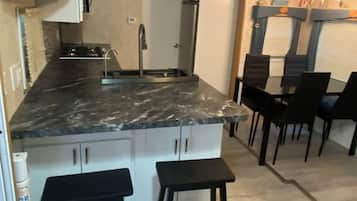 Fridge, microwave, stovetop, coffee/tea maker