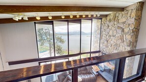 A balcony with a stone wall and a view of a lake. - On Lake, WOW Views, Big Deck! Walk to Amp, Events, Parks, Marina, Tiki Bar (Dillon)
