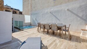 A rooftop patio with a pool, outdoor seating, and a view of the cityscape. - Impressive 3 bedrooms, sun terrace, jacuzzi AMRA1-1 (Sliema)