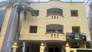 A multi-story building with a sign advertising 'Miracle Home Stays' and 'A/C Rooms'. - Hotel Miracle Stay (Bhubaneshwar)