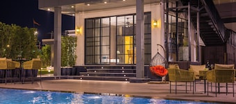 ELIVAAS Ibiza Luxe 4-BHK Farmhouse