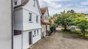 A narrow cobblestone street lined with traditional European-style buildings, featuring gabled roofs and a clear sky. - Holiday Home 'Feußner' with Wi-Fi (Schwalmtal)