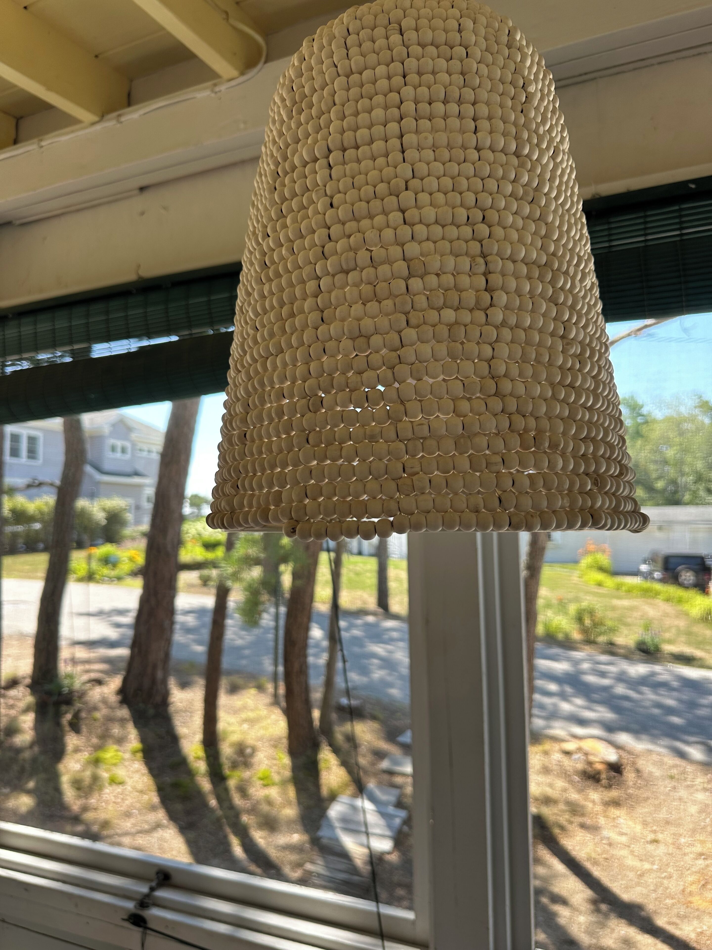 A textured lamp with a cylindrical shape and a patterned surface.