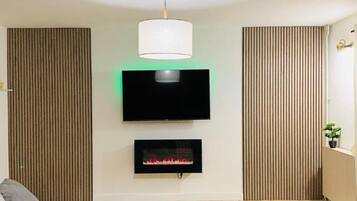 Apartment (Two Bedroom Apartment) | Living room | 32-inch flat-screen TV with satellite channels