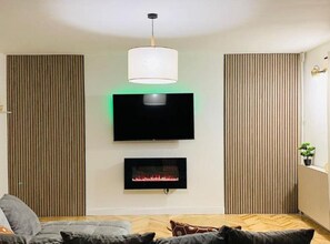 Apartment (Two Bedroom Apartment) | Living room | 32-inch flat-screen TV with satellite channels