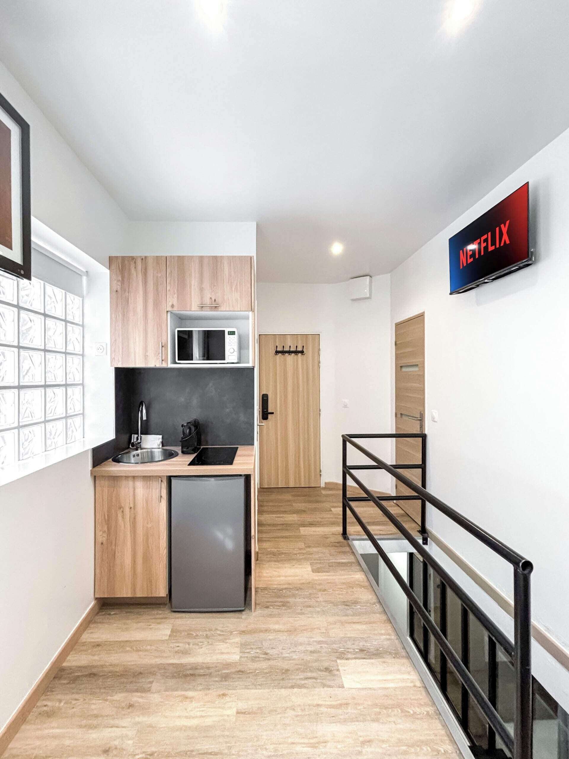 Fridge, microwave, coffee/tea maker, cookware/dishes/utensils