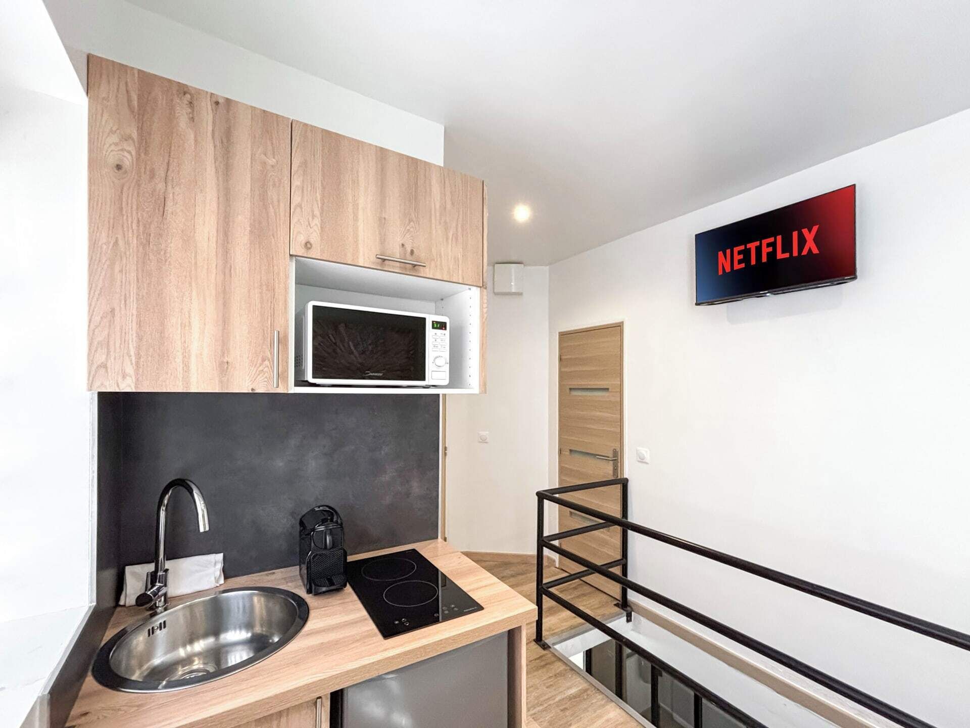 Fridge, microwave, coffee/tea maker, cookware/dishes/utensils