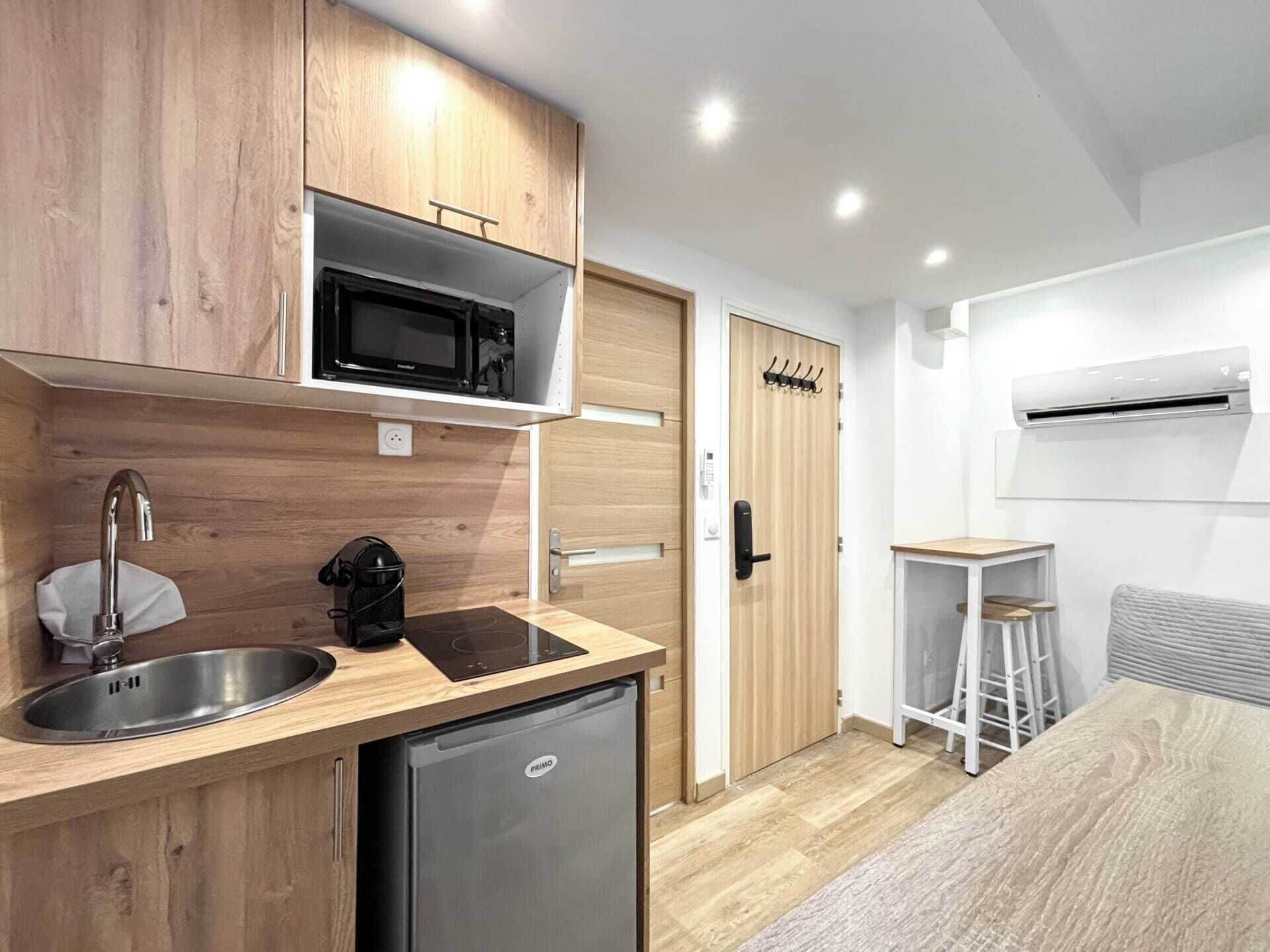 Fridge, microwave, coffee/tea maker, cookware/dishes/utensils