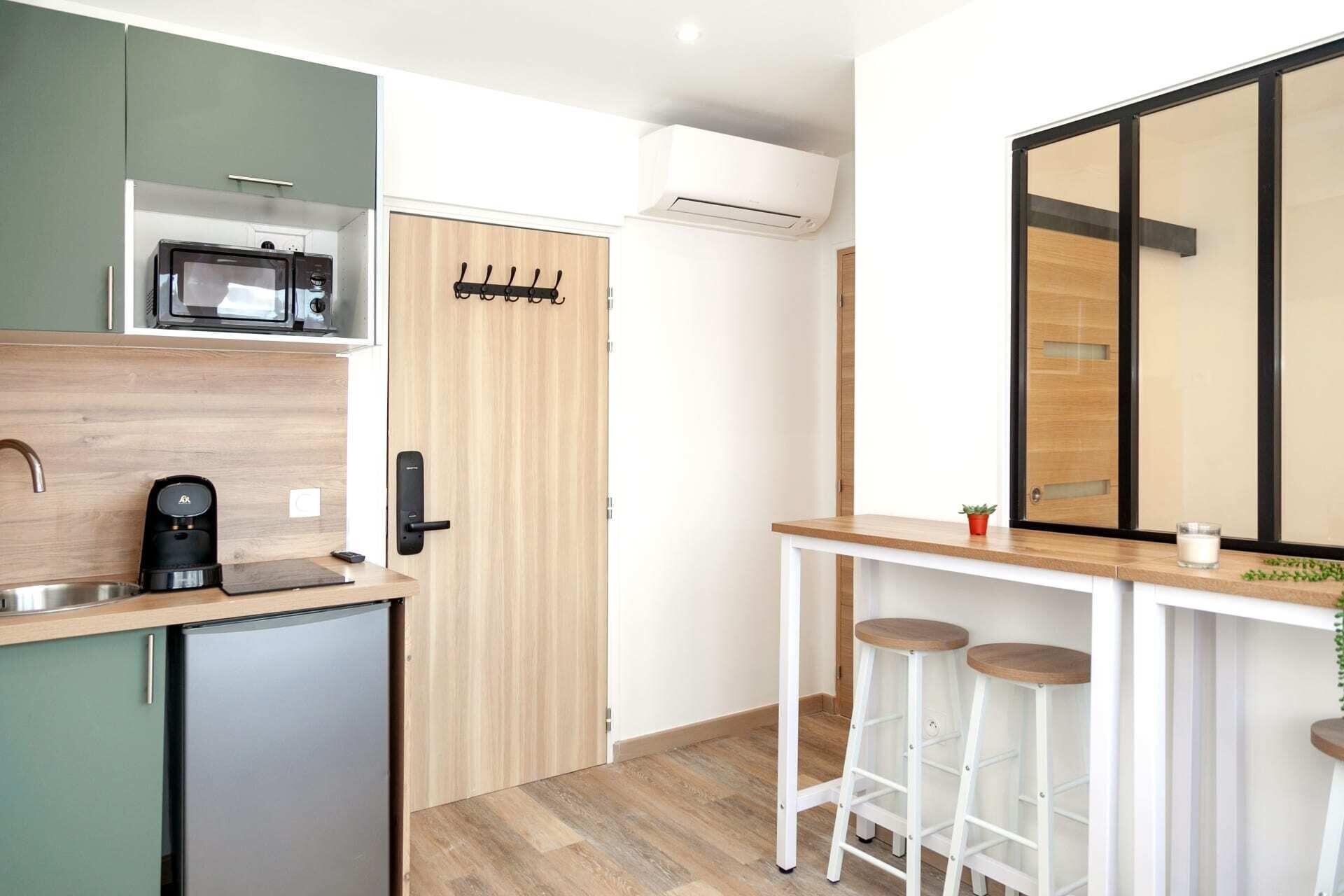 Fridge, microwave, coffee/tea maker, cookware/dishes/utensils