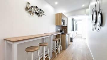 Fridge, microwave, coffee/tea maker, cookware/dishes/utensils