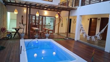 Outdoor pool, open 9:00 AM to 8:00 PM, pool loungers