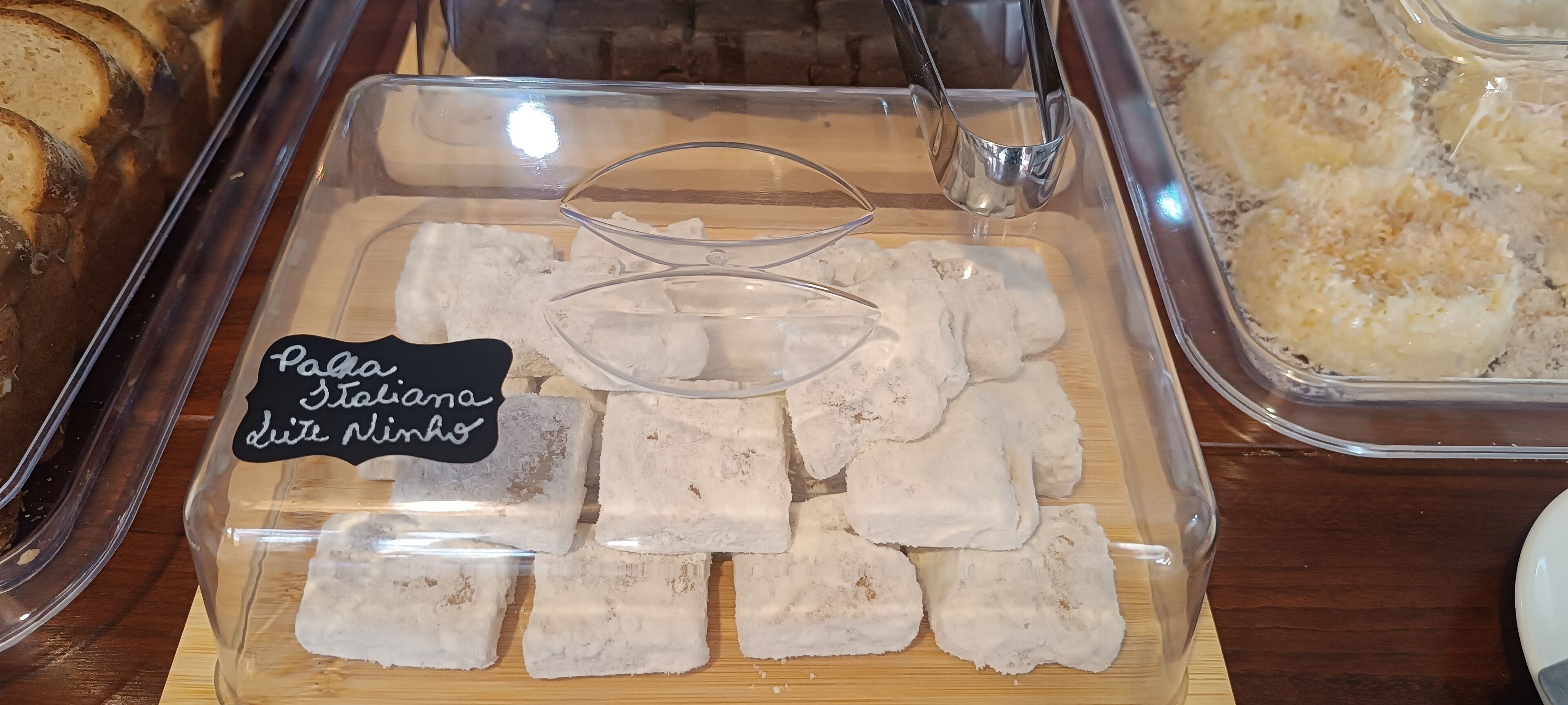 A display of Pola-style cheese cubes in a clear container.