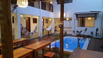 Outdoor pool, open 9:00 AM to 8:00 PM, pool loungers