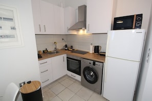 Fridge, coffee/tea maker, toaster, cookware/dishes/utensils
