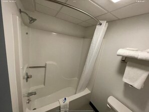 Bathtub, hair dryer, towels, soap