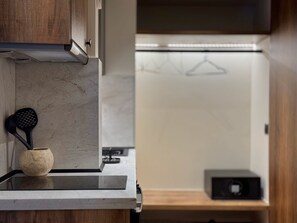 Fridge, stovetop, electric kettle, cookware/dishes/utensils