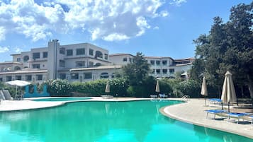 Seasonal outdoor pool, pool umbrellas, pool loungers